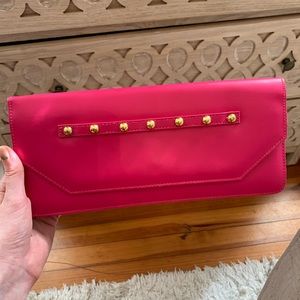 Hot pink clutch with gold studs